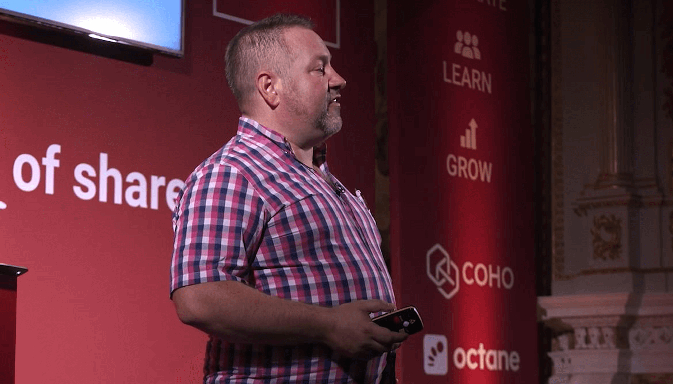 Adam Lawrence speaking at the HMO Summit